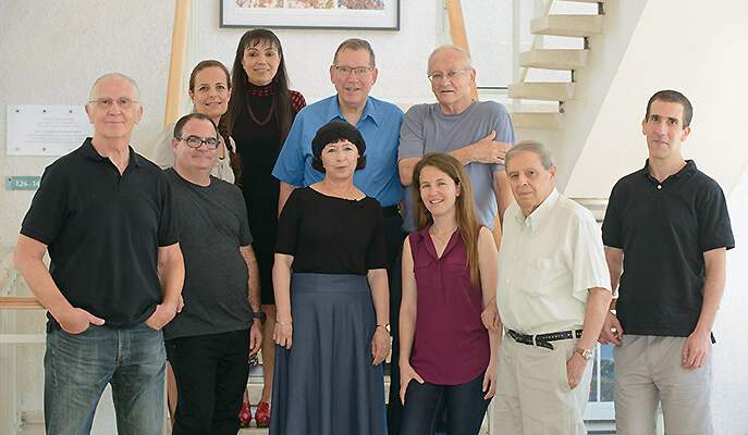 Top: Drs. Tamar Unger and Orly Dym, Prof. Joel Sussman and Dr. Yacov Ashani. Bottom: Drs. Jaime Prilusky, Moshe Goldsmith and Shira Albeck, Adi Goldenzweig, Prof. Israel Silman and Dr. Sarel Fleishman