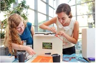 (l-r) Noa Brendel and Avital Sandler of the Aharon Katzir High School working to perfect their final project